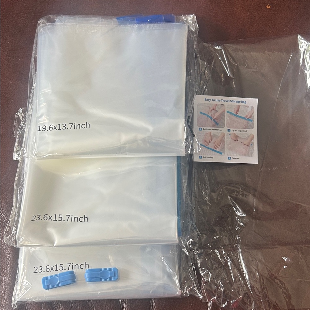 Set of Clear Reusable Vacuum Storage Bags with Blue Clips